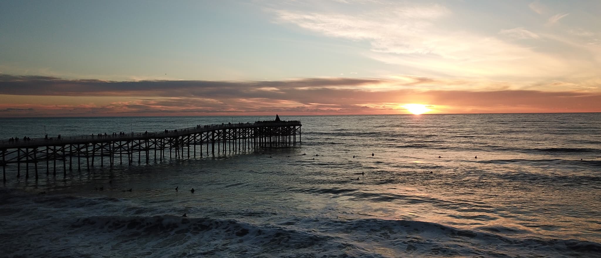 Screenshots of the Pacific Beach Pier showing desktop version